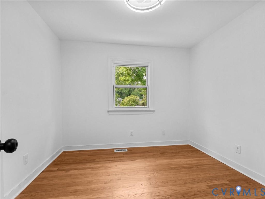 7361 Creekridge Road, Henrico, VA 23231 Hardwood flooring, crisp white walls, single window with natural light, ceiling-mounted light fixture, white trim
