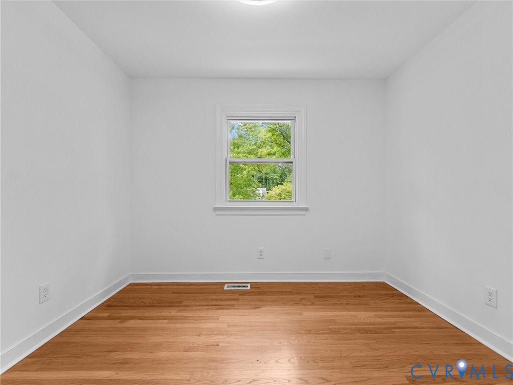 7361 Creekridge Road, Henrico, VA 23231 Wood-finish flooring with white trim and a single window