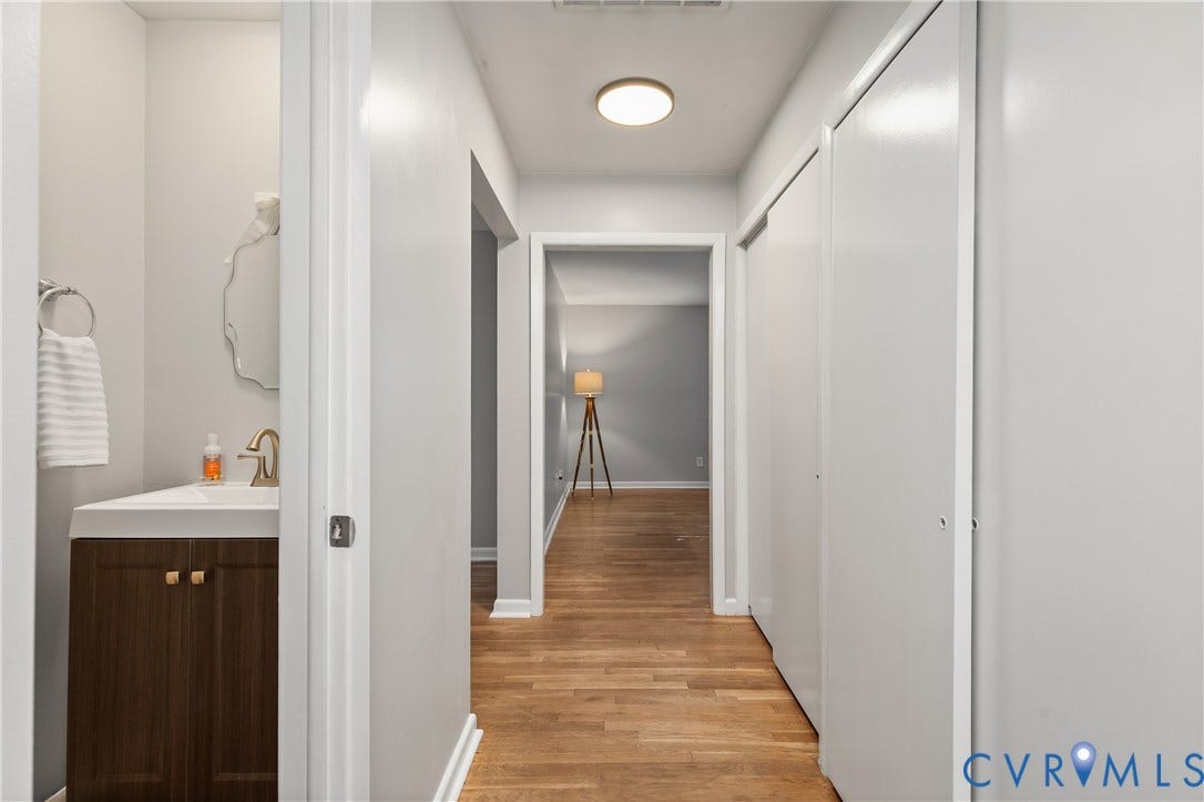 300 Gunby Drive, Henrico, VA 23229 Hallway with wood-finish flooring, recessed lighting, and a built-in closet with sliding doors