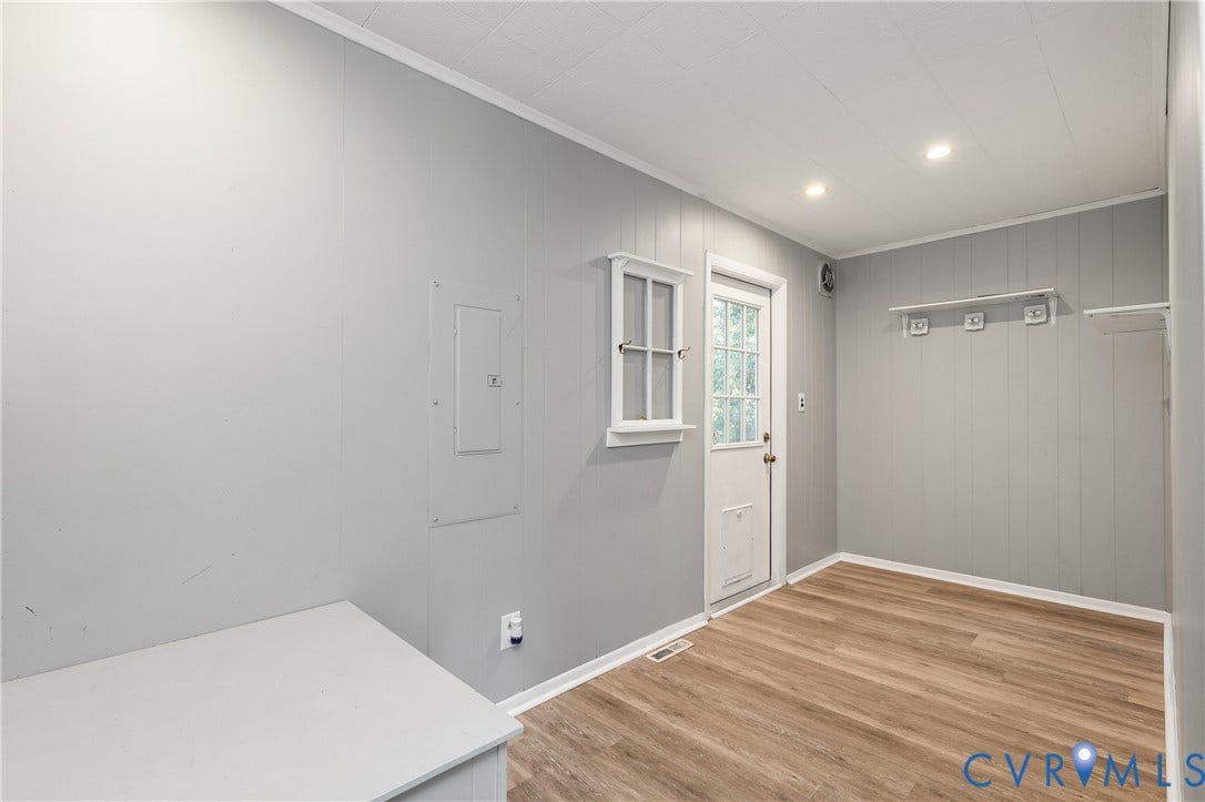 300 Gunby Drive, Henrico, VA 23229 Wood-finish flooring, recessed ceiling lighting, light gray paneling, and a white exterior door