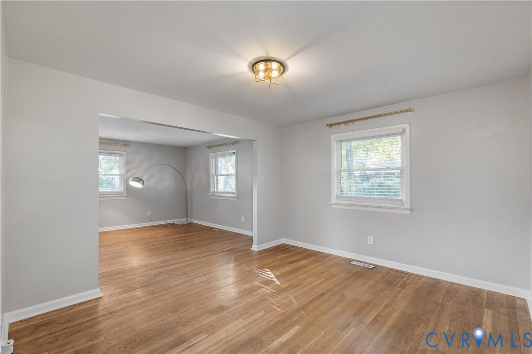 300 Gunby Drive, Henrico, VA 23229 Hardwood flooring, light gray wall paint, white trim, recessed ceiling light, and multiple windows