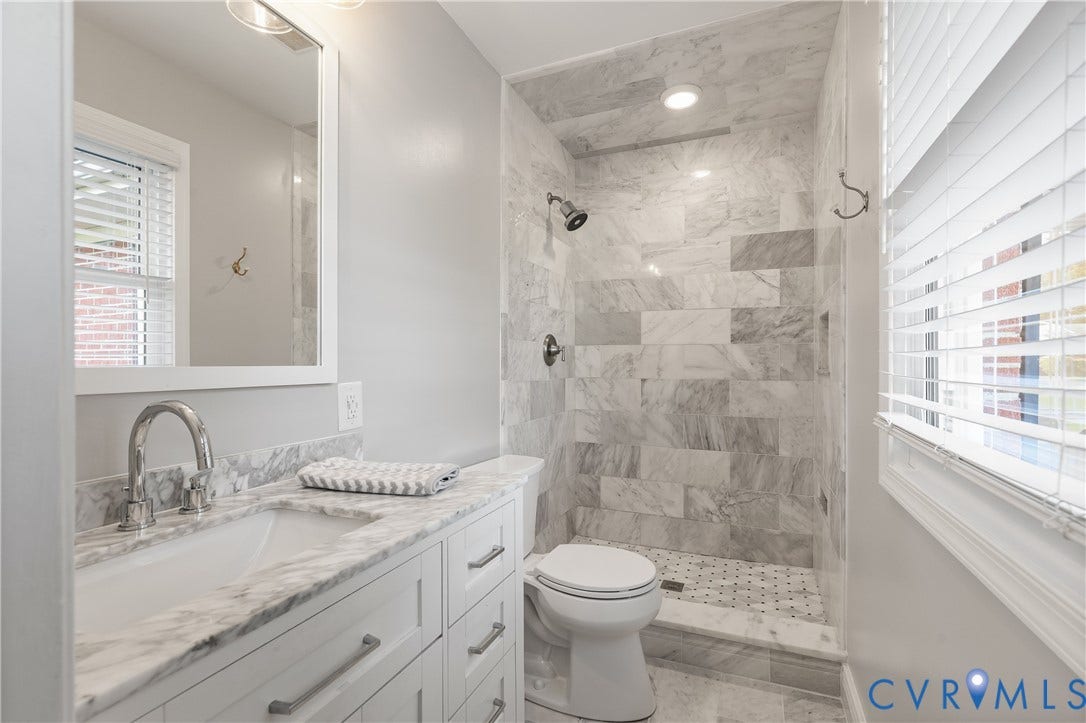 300 Gunby Drive, Henrico, VA 23229 Vanity with an undermount sink, stone countertop, and white cabinetry