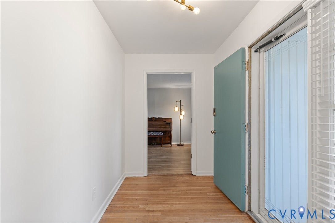 300 Gunby Drive, Henrico, VA 23229 Wood-finish flooring with white baseboards and neutral wall paint