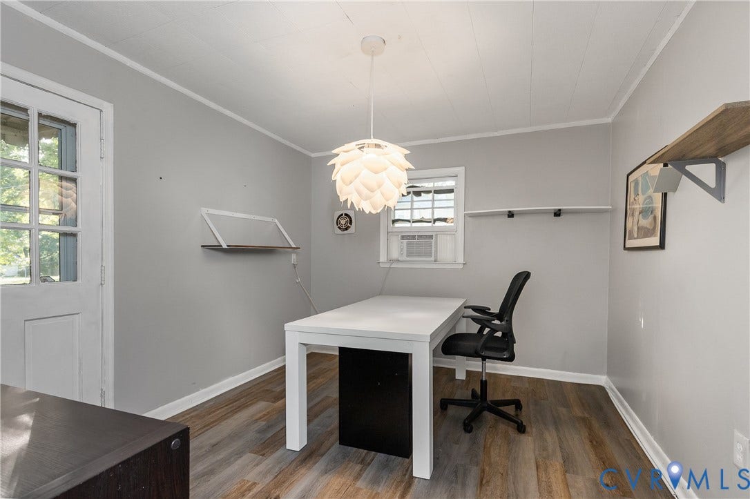 300 Gunby Drive, Henrico, VA 23229 Wood-finish flooring, white trim, suspended decorative light fixture, window with an air conditioning unit, and a glass-paneled door