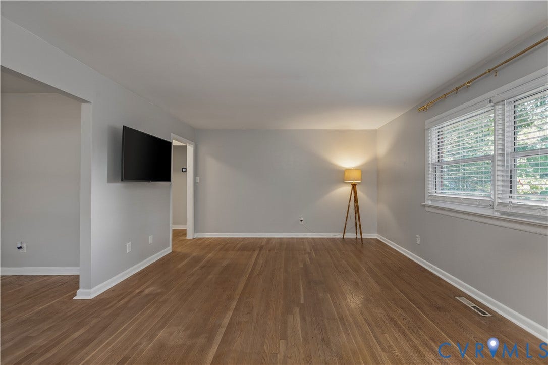 300 Gunby Drive, Henrico, VA 23229 Hardwood flooring, painted interior walls, architectural archway, white trim, and a window with blinds