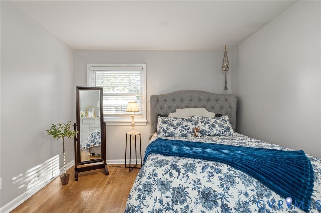 300 Gunby Drive, Henrico, VA 23229 Wood-finish flooring, light grey wall paint, and a window with white blinds