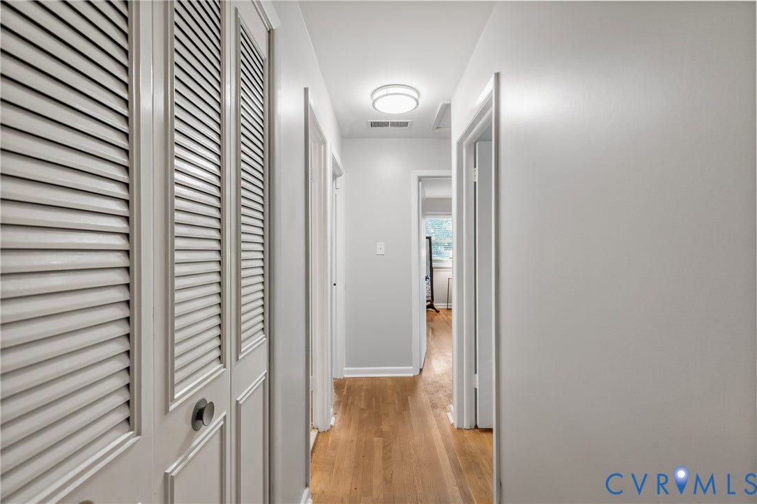 300 Gunby Drive, Henrico, VA 23229 Light wood-finish flooring, louvered bi-fold doors, flush-mount ceiling light fixture, and white wall finishes