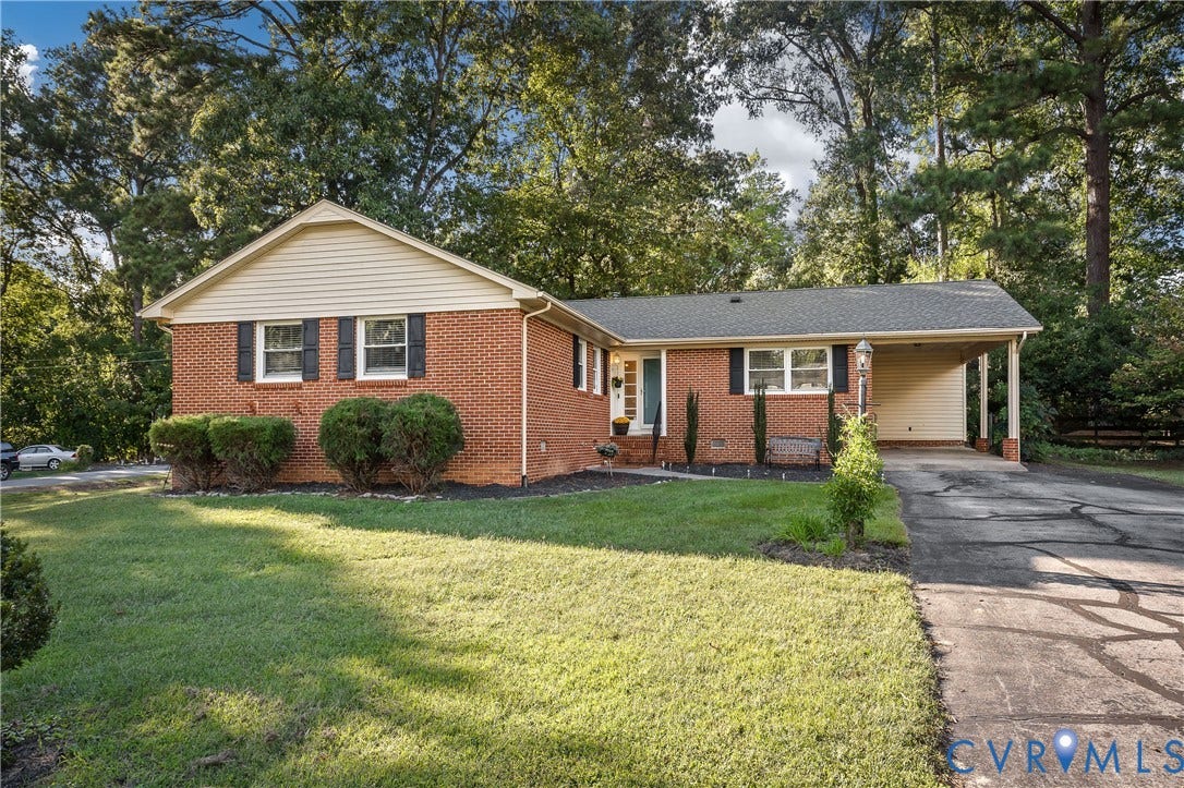 300 Gunby Drive, Henrico, VA 23229 Brick exterior featuring a gabled roof and white siding accents