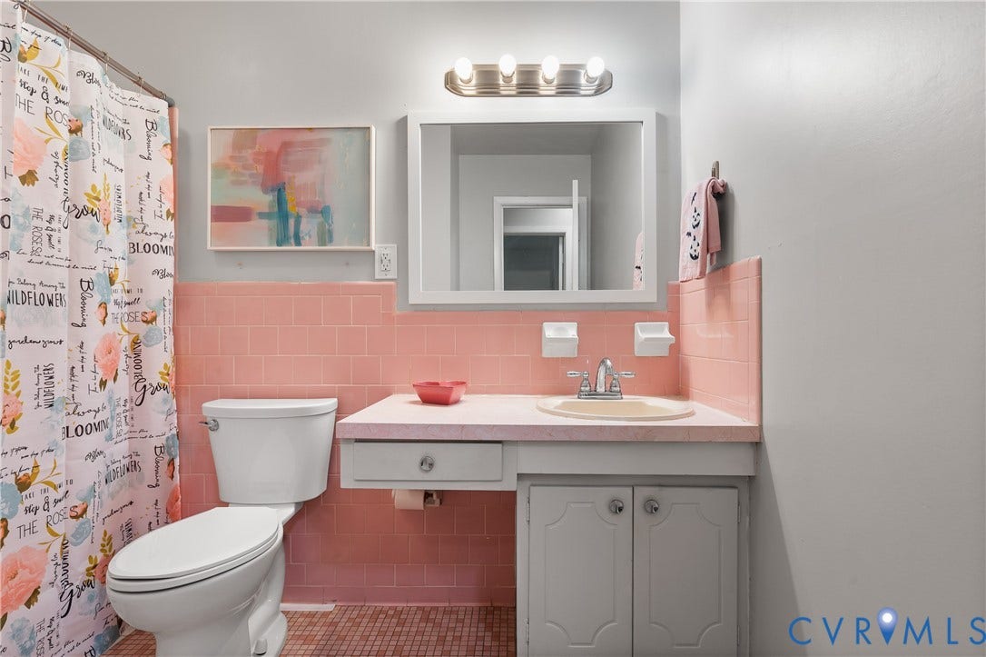 300 Gunby Drive, Henrico, VA 23229 Vanity with integrated sink, wall-mounted mirror, and overhead lighting