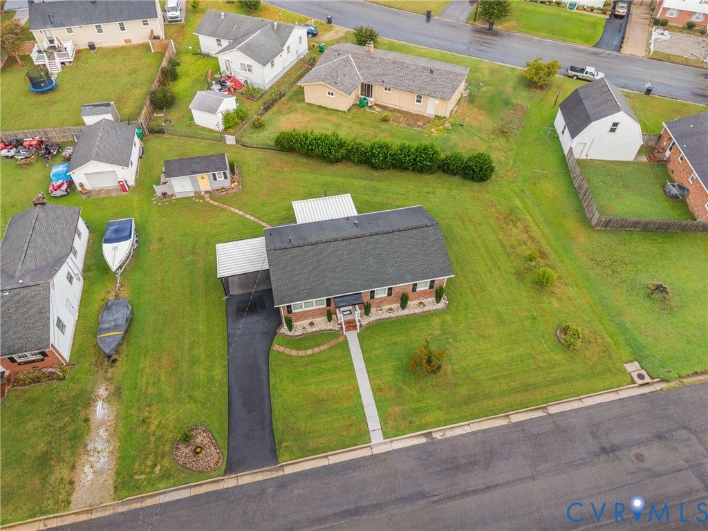 822 Old Town Drive, Colonial Heights, VA 23834 Brick exterior with a covered carport, paved driveway, and established front landscaping