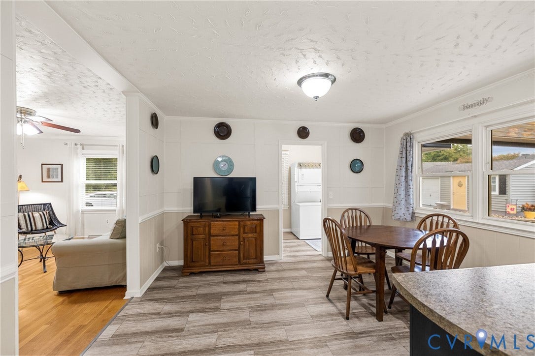 822 Old Town Drive, Colonial Heights, VA 23834 Open-concept living space with wood-finish flooring, white walls, and a built-in light fixture