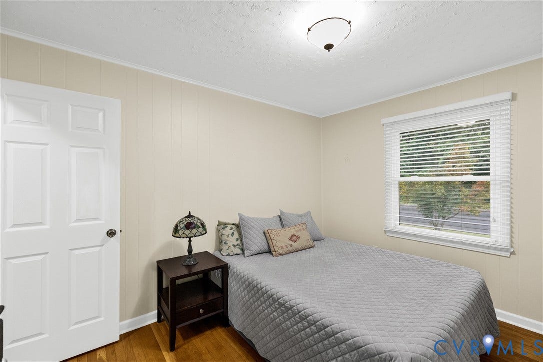 822 Old Town Drive, Colonial Heights, VA 23834 Wood-finish flooring, paneled interior door, window with blinds, and ceiling-mounted light fixture