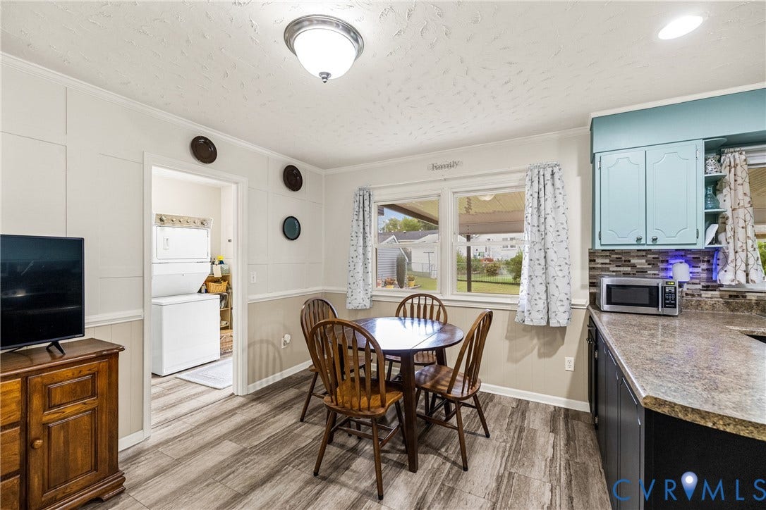822 Old Town Drive, Colonial Heights, VA 23834 Kitchen dining area featuring wood-finish flooring and a window overlooking the property