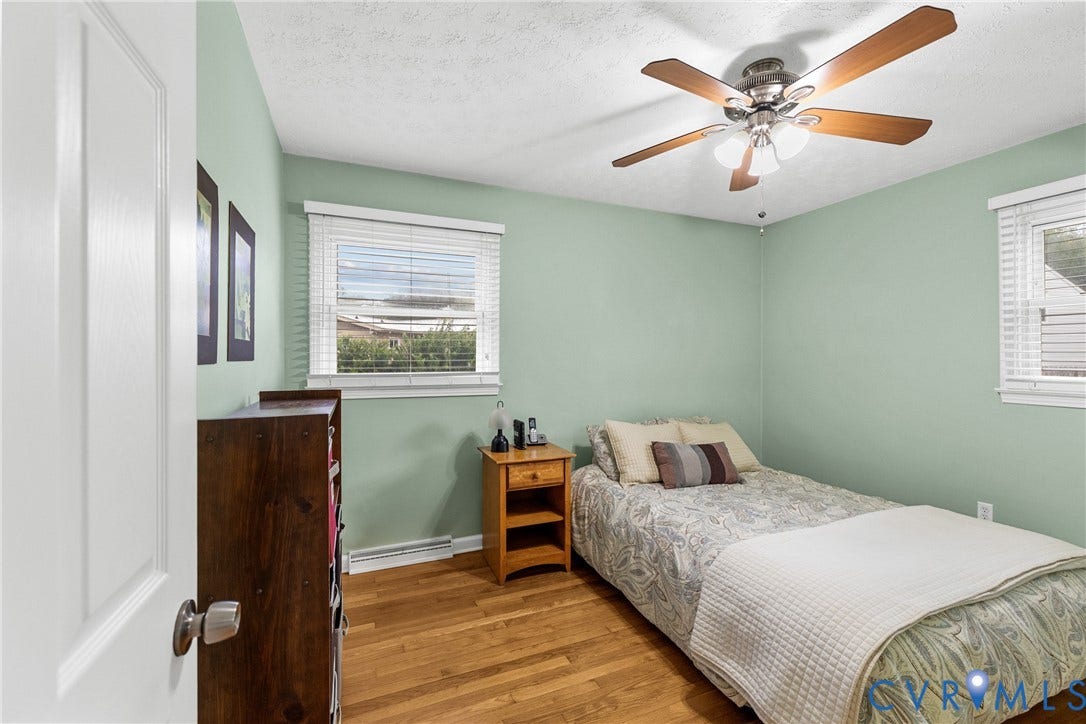 822 Old Town Drive, Colonial Heights, VA 23834 Wood-finish flooring with a ceiling fan light fixture and window with blinds
