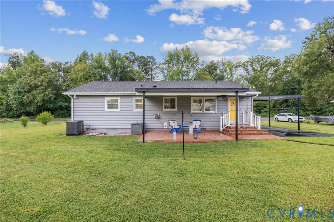 822 Old Town Drive, Colonial Heights, VA 23834 Expansive green lawn, wood-tone deck, attached covered patio, covered carport, and mature trees