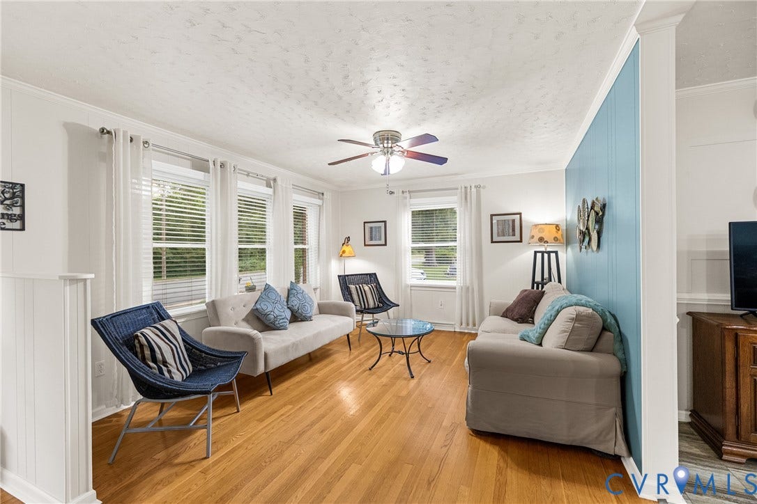 822 Old Town Drive, Colonial Heights, VA 23834 Hardwood flooring, multiple windows with blinds, ceiling fan, crown molding, and wainscoting