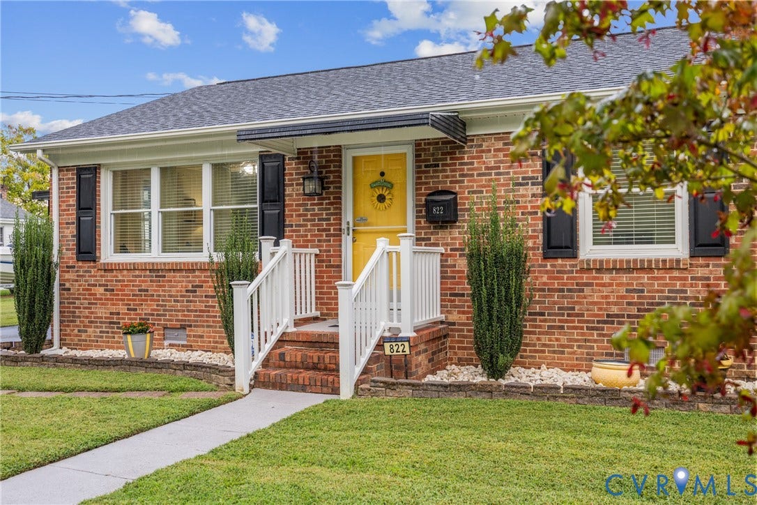 822 Old Town Drive, Colonial Heights, VA 23834 Brick exterior with white trim, dark gray shingles, yellow front door, and white porch railing