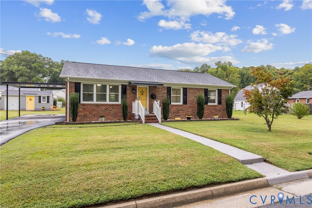 822 Old Town Drive, Colonial Heights, VA 23834 Brick facade, front lawn, carport, paved driveway, and sidewalk