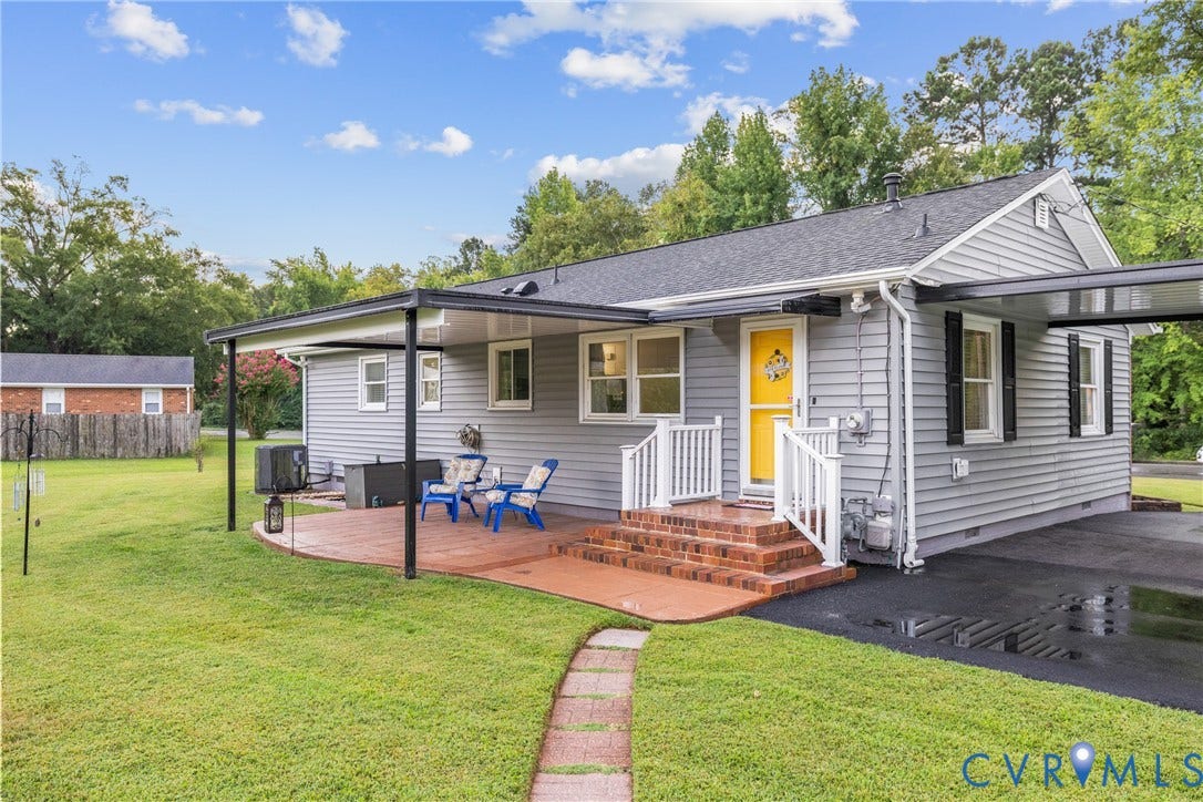 822 Old Town Drive, Colonial Heights, VA 23834 Siding exterior with a covered patio, brick steps, and a paved driveway