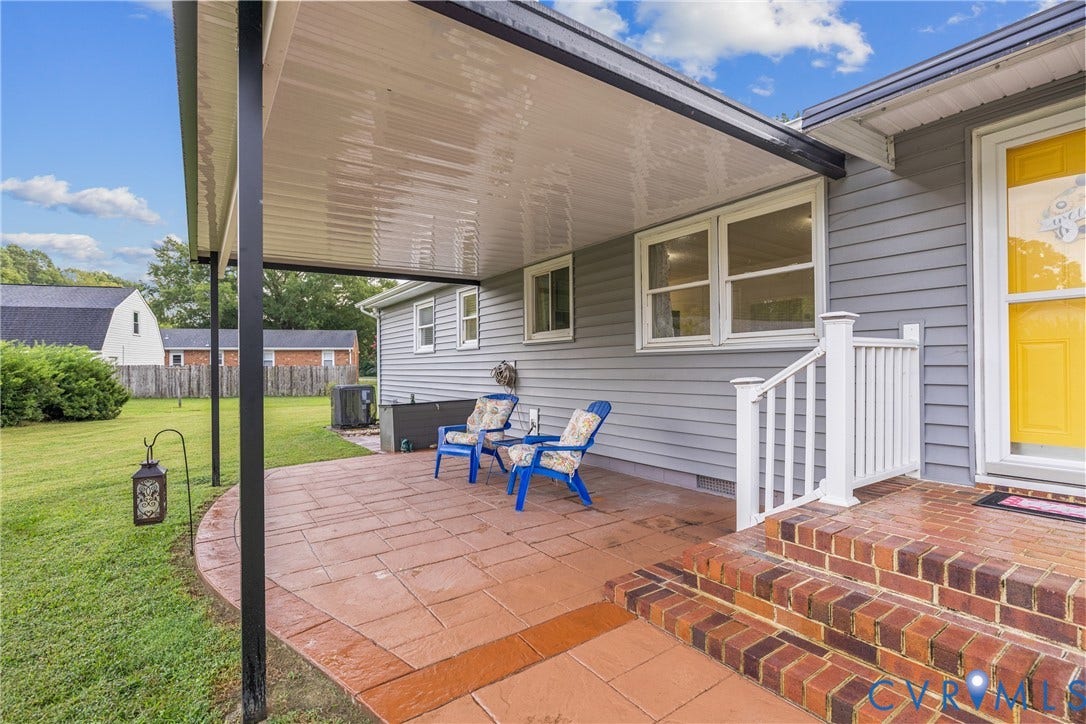 822 Old Town Drive, Colonial Heights, VA 23834 Covered patio featuring stamped concrete, brick steps, and a white railing