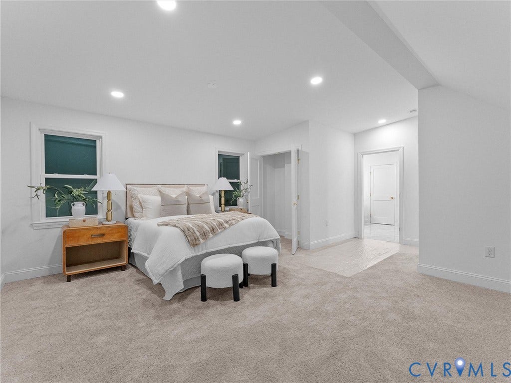 Recessed lighting throughout, wall-to-wall carpeting, and multiple windows