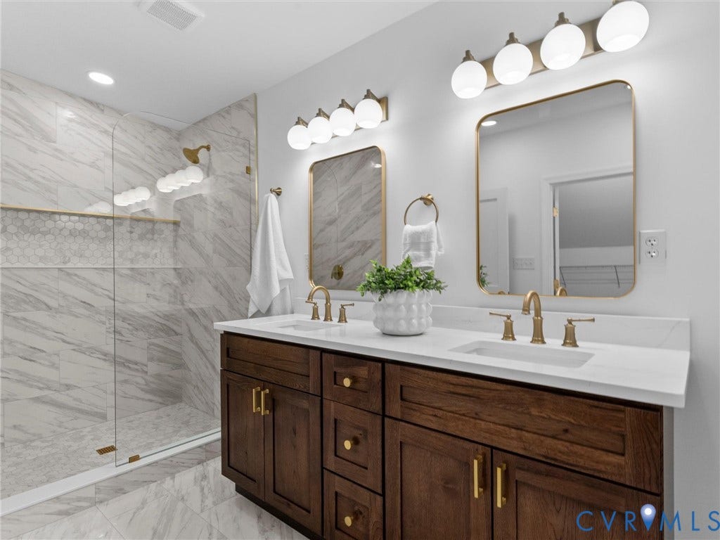 Dual-sink vanity with wood-finish cabinetry