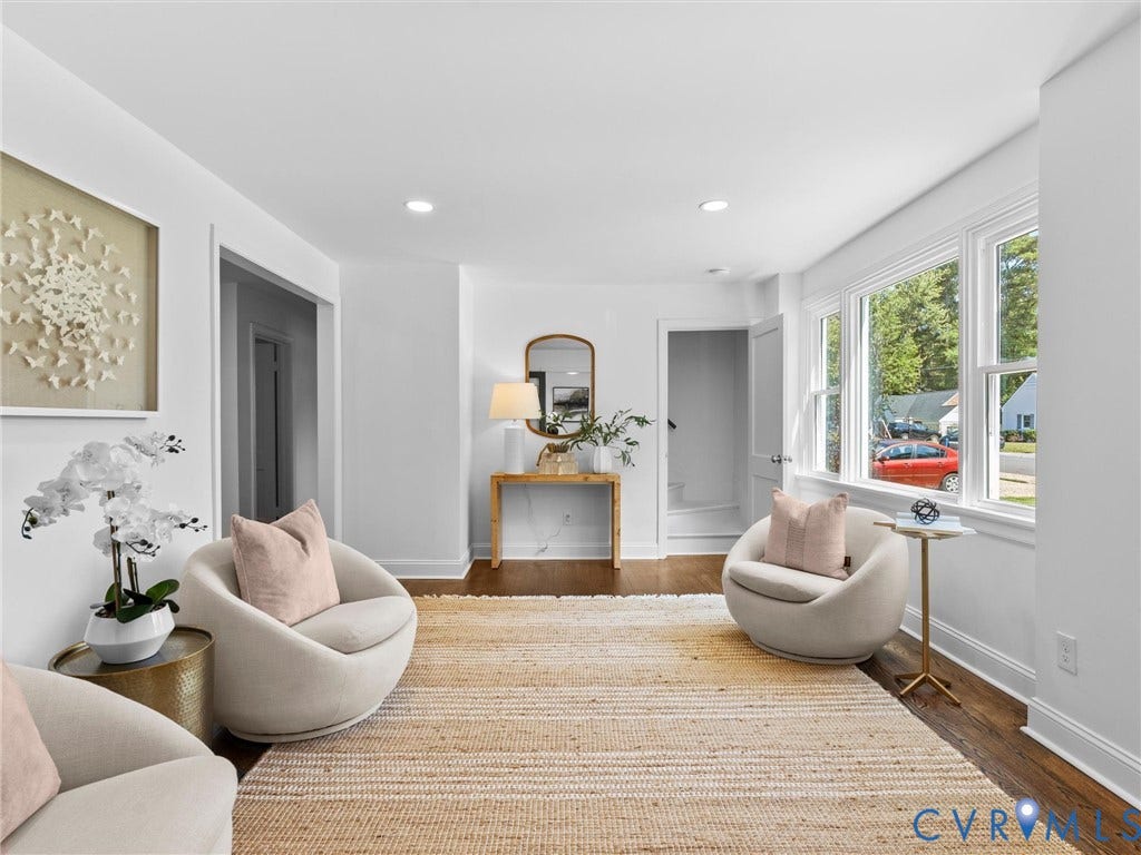 Hardwood flooring, recessed lighting, white trim, white walls, and multiple windows