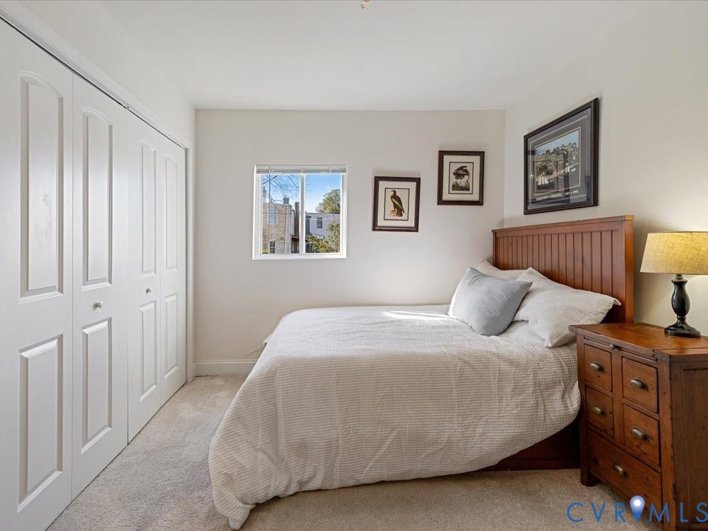 2021 Venable Street, Union Hill, Richmond, VA 23223 Double bi-fold closet doors, carpet flooring, a single window, and neutral wall tones