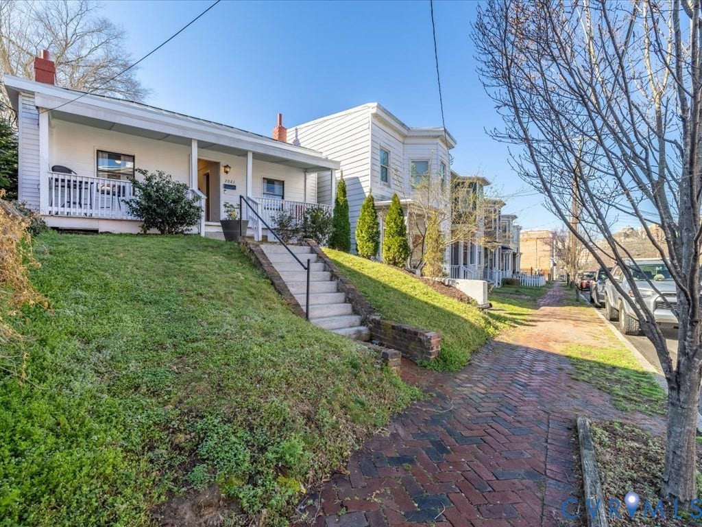 2021 Venable Street, Union Hill, Richmond, VA 23223 White siding exterior with a covered front porch and concrete steps