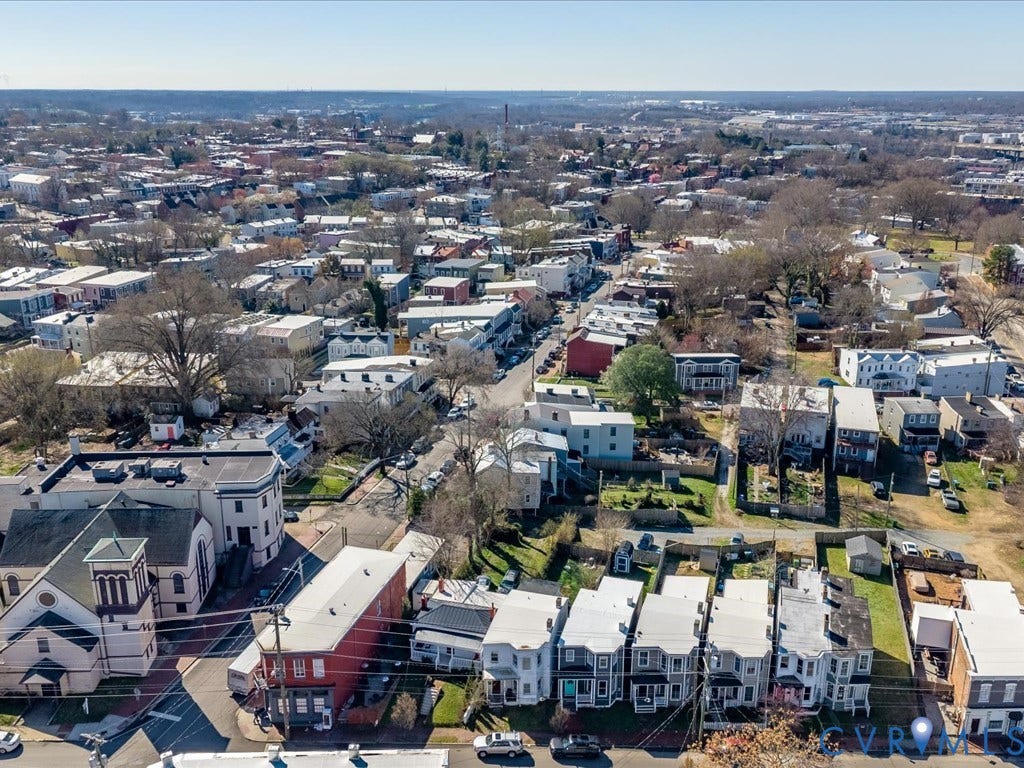 2021 Venable Street, Union Hill, Richmond, VA 23223 Dense urban neighborhood featuring a variety of architectural styles, mature trees, and street parking