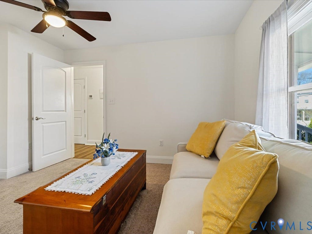 2021 Venable Street, Union Hill, Richmond, VA 23223 Neutral wall tones, carpeted flooring, a ceiling fan with integrated lighting, and a white paneled door