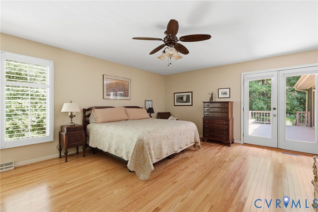 13701 Harbourwood Road, Harbourwood, Midlothian, VA 23112 Spacious primary bedroom with lots of natural light, access to deck.