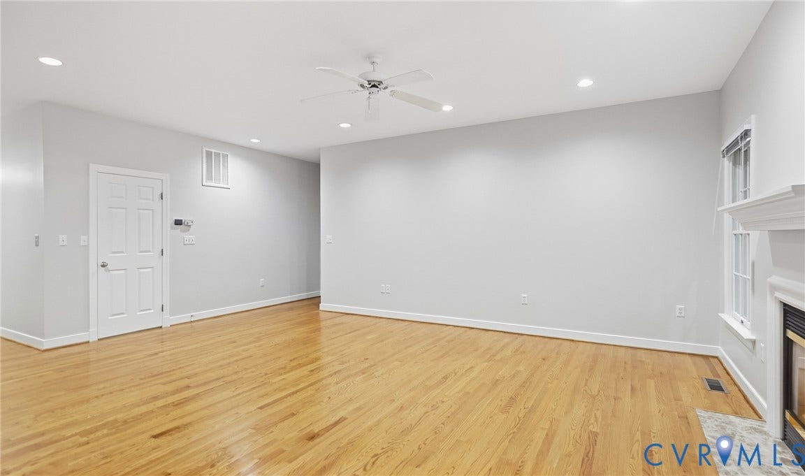 5500 Lakemere Drive, 55+ Community, North Chesterfield, VA 23234 Hardwood flooring, recessed lighting, ceiling fan, white paneled door, and a fireplace with a mantel