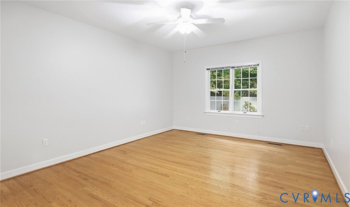 5500 Lakemere Drive, 55+ Community, North Chesterfield, VA 23234 Hardwood flooring, white walls, white trim, single window, and a ceiling fan with light fixture