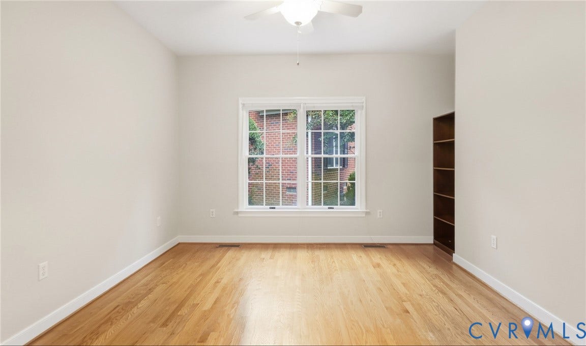 5500 Lakemere Drive, 55+ Community, North Chesterfield, VA 23234 Hardwood flooring, white trim, white walls, built-in shelving, and a ceiling fan