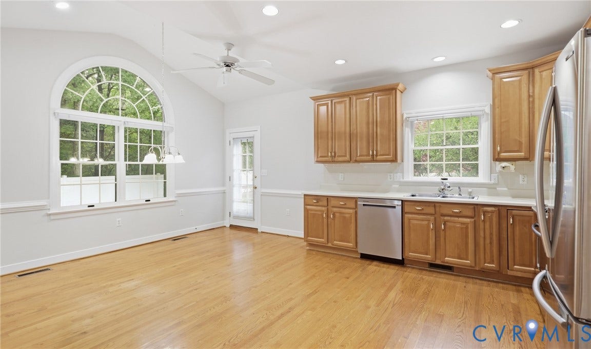 5500 Lakemere Drive, 55+ Community, North Chesterfield, VA 23234 Vaulted ceiling, arched window, wood-finish flooring, wood cabinetry, stainless steel appliances