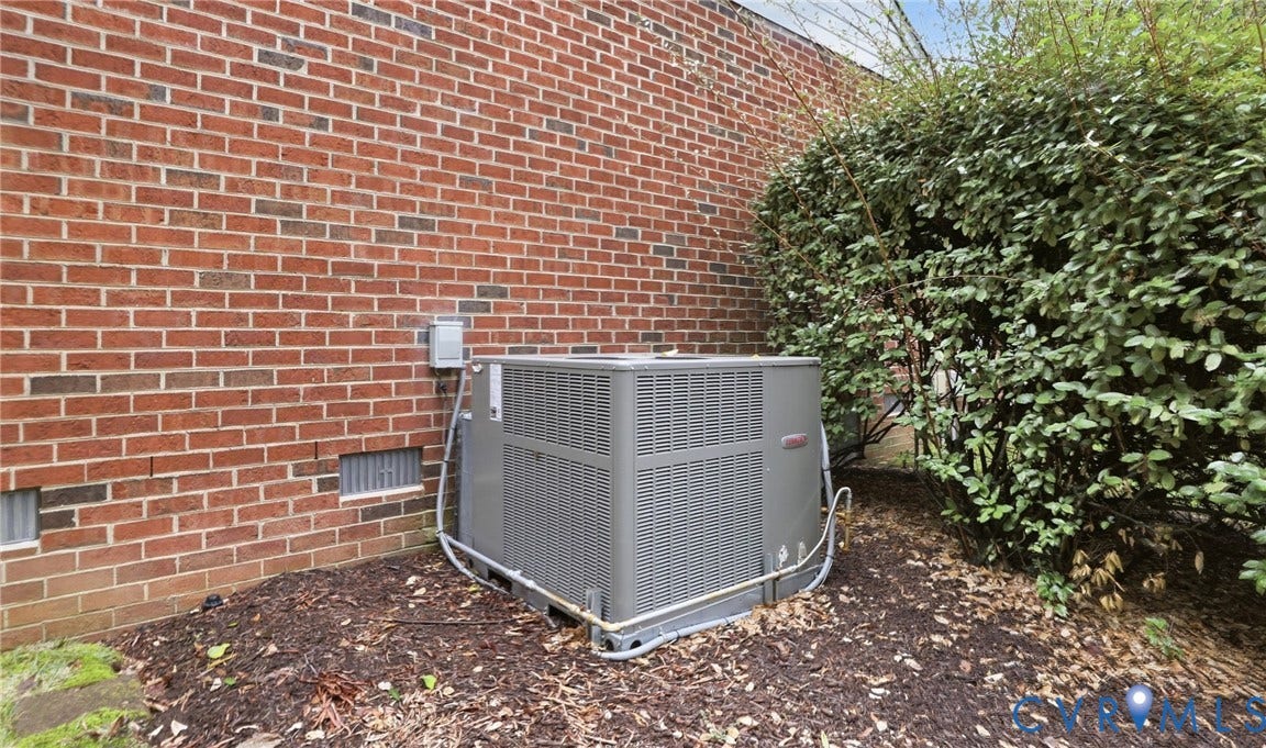5500 Lakemere Drive, 55+ Community, North Chesterfield, VA 23234 Brick exterior with a ground-mounted HVAC unit and surrounding landscaping