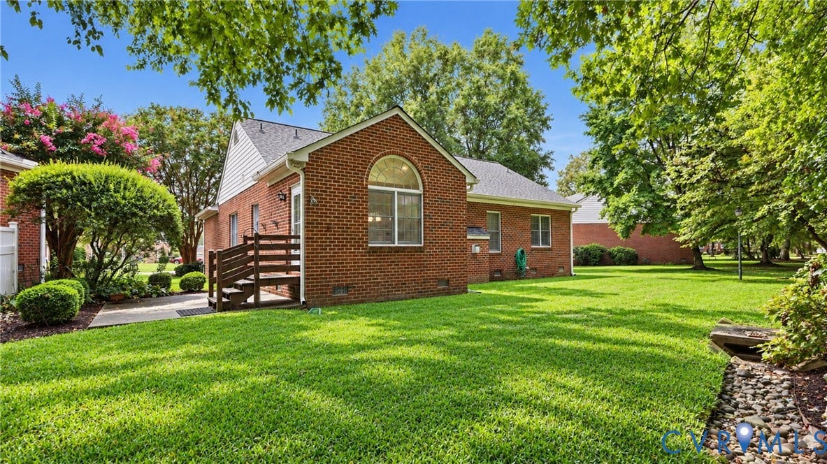 5500 Lakemere Drive, 55+ Community, North Chesterfield, VA 23234 Brick exterior with an arched window, private rear patio, and a wood deck with stairs