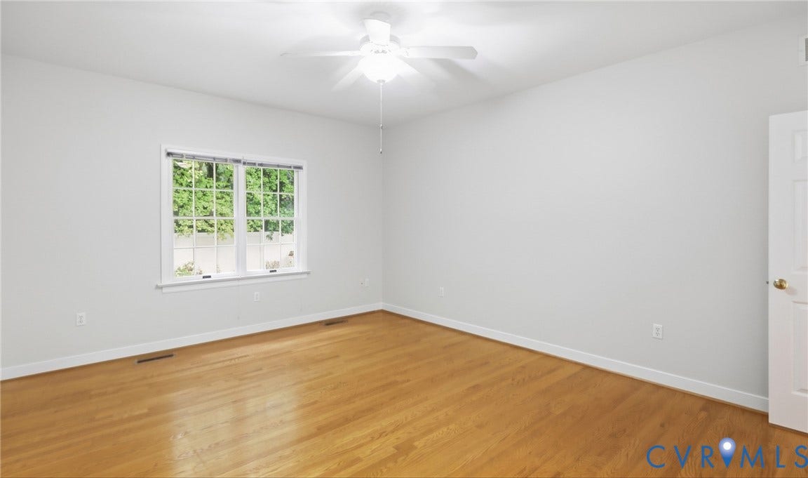 5500 Lakemere Drive, 55+ Community, North Chesterfield, VA 23234 Hardwood-style flooring, white walls, and a ceiling fan with light fixture