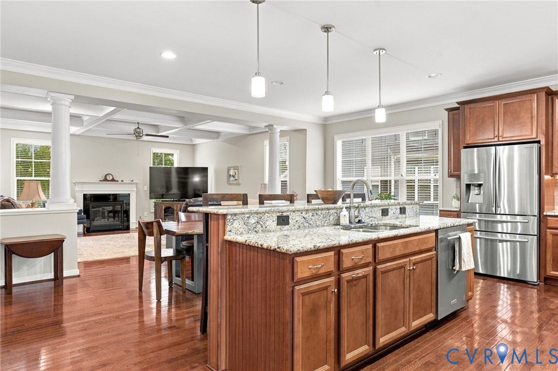 Kitchen featuring granite countertops, stainless steel appliances, and pendant lighting
