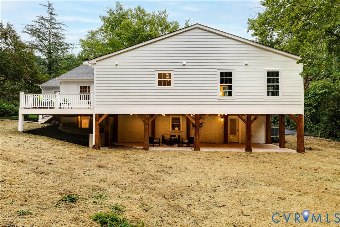 702 Westham Parkway, Westham, Henrico, VA 23229 Exterior featuring white horizontal siding, a spacious elevated deck with white railings, a covered patio area with exposed timber supports, and multiple sash windows