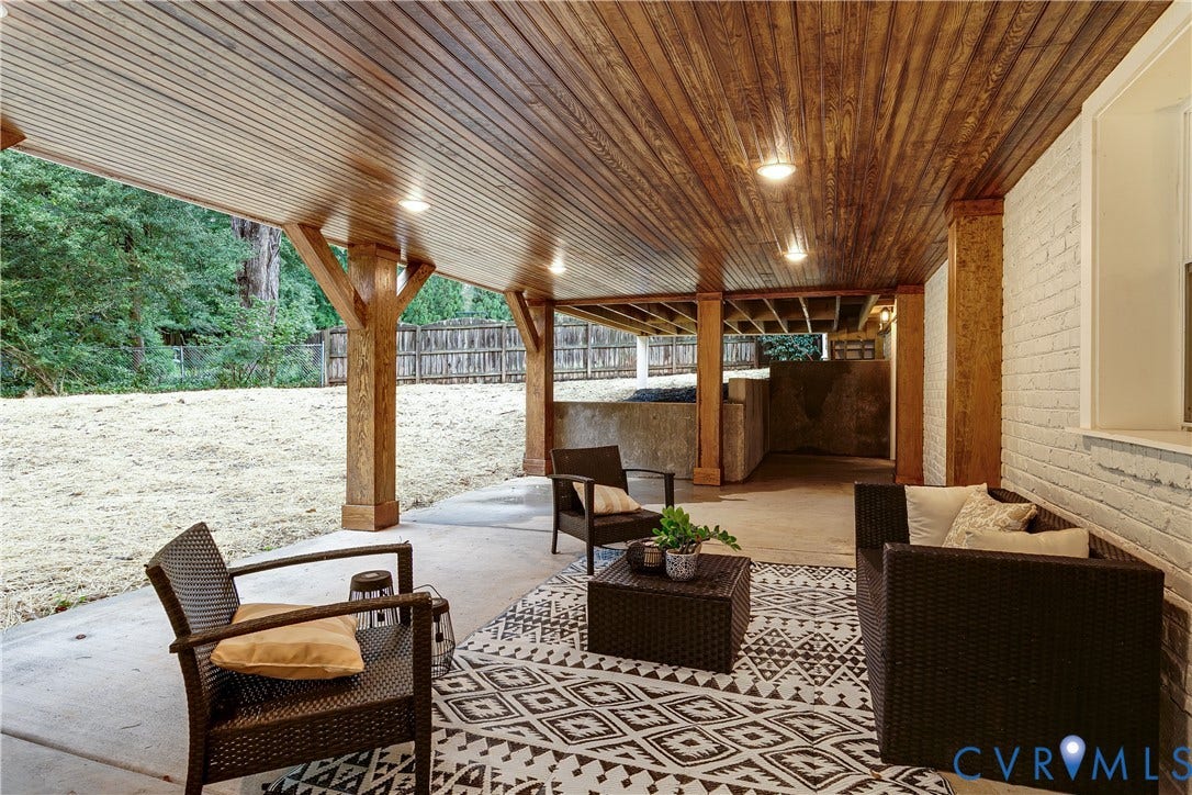 702 Westham Parkway, Westham, Henrico, VA 23229 Covered outdoor patio with concrete flooring, recessed lighting, wood-paneled ceiling, and structural wood support beams
