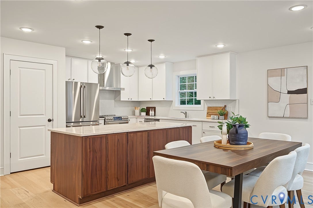 702 Westham Parkway, Westham, Henrico, VA 23229 White shaker cabinetry, stainless steel appliances, wood-finish flooring, recessed lighting, and a kitchen island with a light-toned countertop