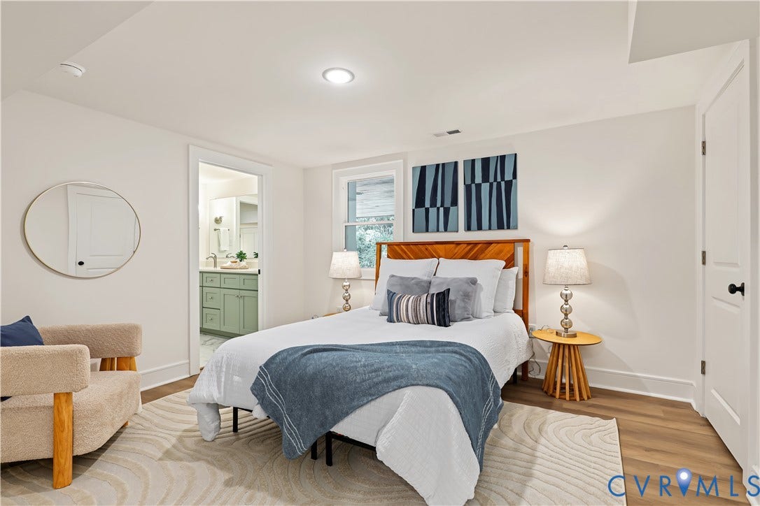702 Westham Parkway, Westham, Henrico, VA 23229 Recessed ceiling lighting, wood-finish flooring, white walls, and a visible doorway to a bathroom with a green vanity