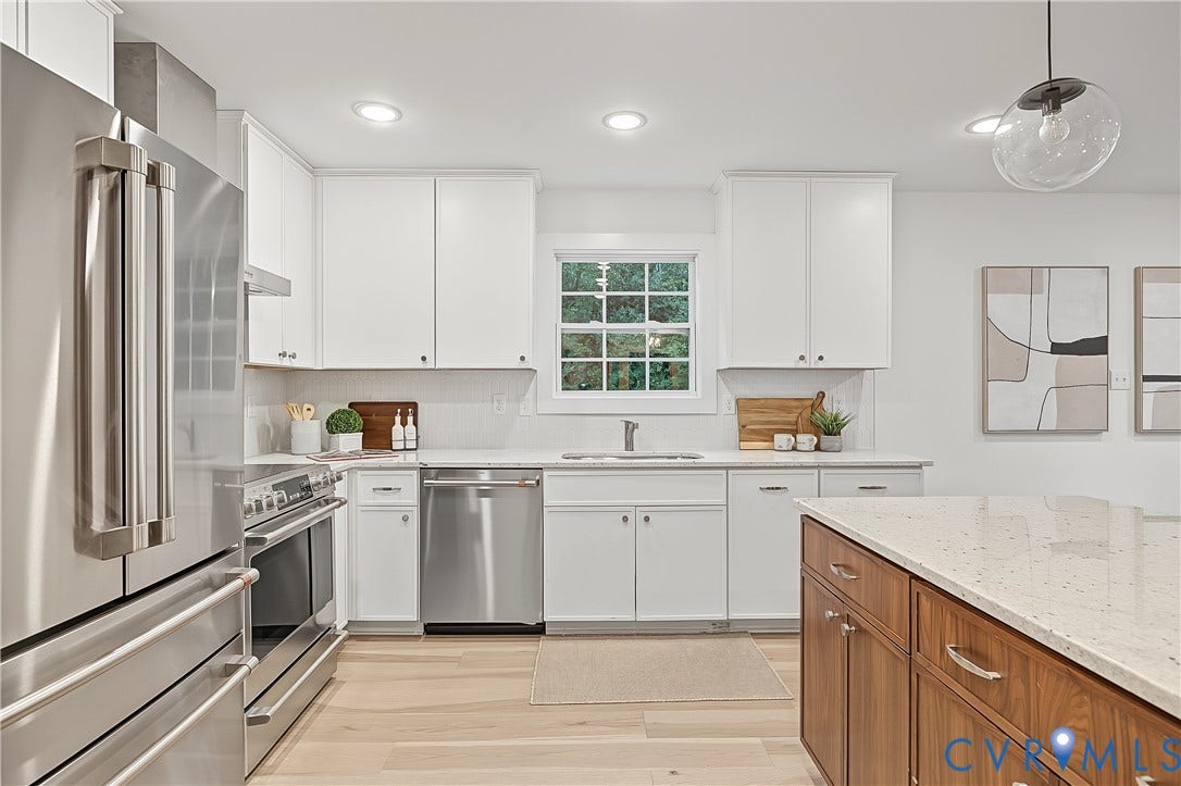 702 Westham Parkway, Westham, Henrico, VA 23229 Kitchen featuring a central island, stainless steel appliances, light wood-finish flooring, white cabinetry, and white countertops