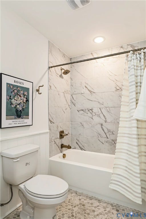 702 Westham Parkway, Westham, Henrico, VA 23229 White paneled walls, white bathtub, marble-look tiled shower surround, recessed ceiling lighting, and hexagonal floor tiling