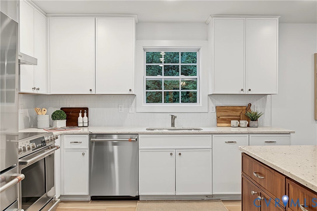 702 Westham Parkway, Westham, Henrico, VA 23229 White shaker cabinetry, stainless steel appliances, light-toned countertops, and a subway tile backsplash
