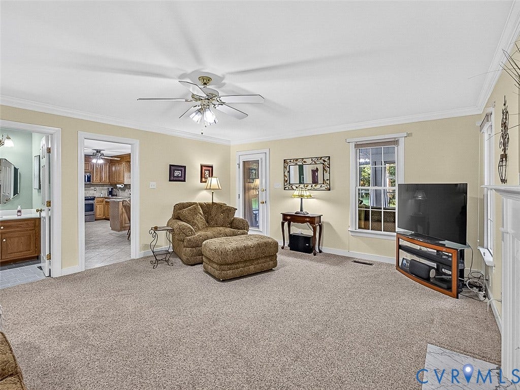 4013 Tweedsmuir Road, Moseley, VA 23120 This 18x16 family room with crown molding, nature view and access to sun room