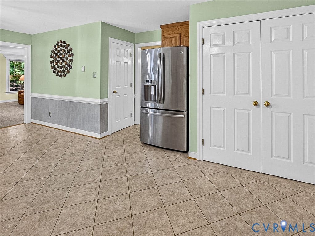 4013 Tweedsmuir Road, Moseley, VA 23120 14.5 x 12 kitchen features custom flooring, stainless steel refrigerator, and access to family room