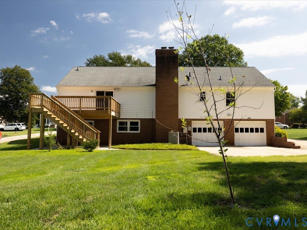 Back yard, garage with extra parking pad